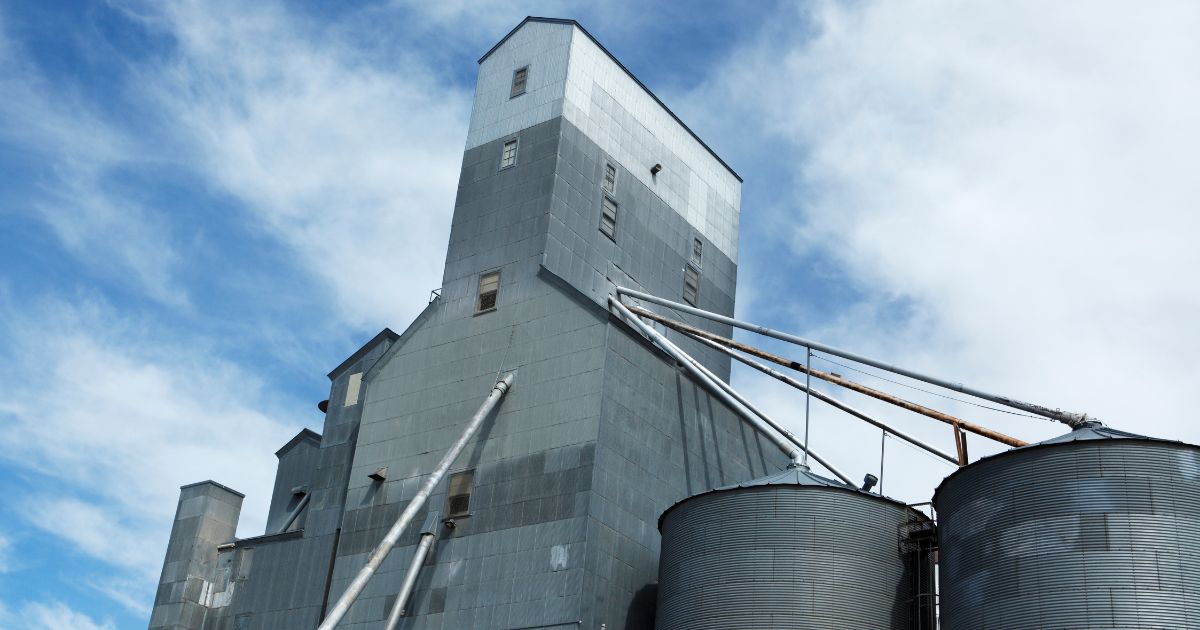 Low-angle view of a large grain elevator.