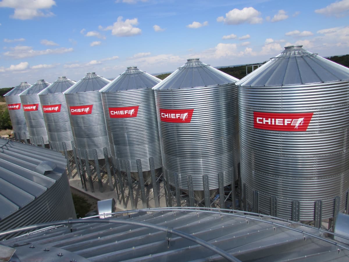 row of grain hoppers High angle view of row of Chief grain hoppers.