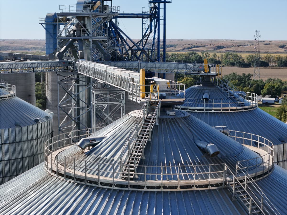 Why Knowing Your Grain Bin Capacity Matters Aerial view of roofs of Chief Agri commercial grain bins.
