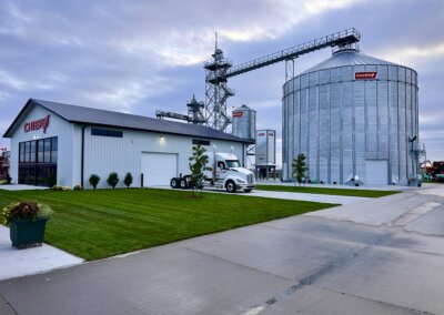 Evening view of The All American Farm lot with Chief Agri grain bin the night before Husker Harvest Days 2025 opened.