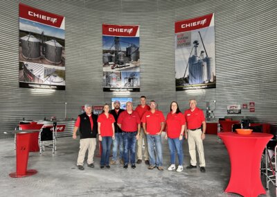 Chief Agri team photo taken inside the grain bin at The All American Farm during Husker Harvest Days 2025.