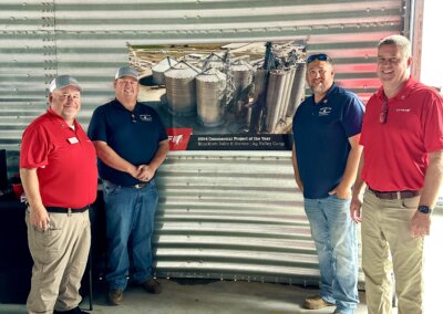 Chief Agri dealers posing next to a completed project banner at The All American Farm during Husker Harvest Days 2025.