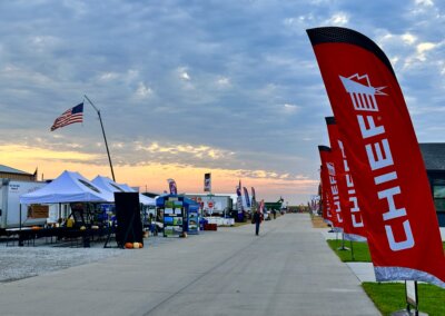 Sunrise at The All American Farm with the American flag flying at Husker Harvest Days 2025.