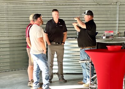 Growers and visitors talking with Chief Agri team members at The All American Farm during Husker Harvest Days 2025.