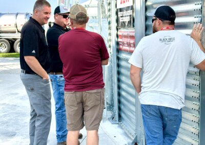 Growers and visitors talking with Chief Agri team members at The All American Farm during Husker Harvest Days 2025.