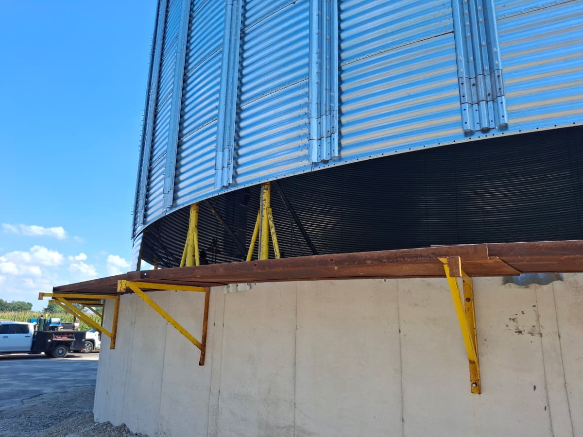 View of a lifted grain bin from outside of the bin.