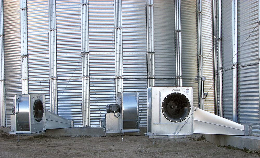 Caldwell fans 4 grain aeration Two large grain bins with fans.