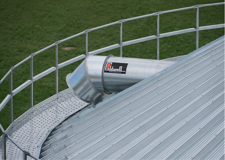 Closeup of gooseneck vents on roof of grain bin.